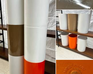 A collection of Kartell Milano waste baskets in white, red, and brown, designed by G. Colombini