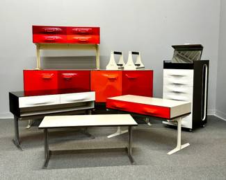 A phenomenal and rare collection of Raymond Loewy "DF2000" series furniture by famed 20th century industrial designer Raymond Loewy for Doubinsky Freres. Loewy's Compagnie de L’Esthetique Industrielle (CEI) in Paris created the design of the DF 2000 modern furniture line, which was then manufactured by Doubinsky Frères and sold in the United States beginning in 1968. These iconic pieces were only manufactured until the early 1970s. Pieces include the portable valet cabinet, an two-sided, eight-door buffet or room divider cabinet, a two-drawer console, and more! 