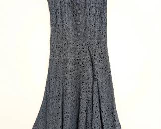 A swingy little vintage black sleeveless dress of woven/crocheted ribbon work or ribbon soutache 