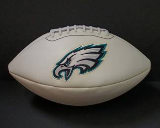 Another view of the Philadelphia Eagles commemorative logo football featuring the team's championship history printed on the white panel. 