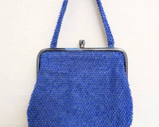 A '60s vintage blue plastic "candy dot" beaded handbag with a kiss-lock closure