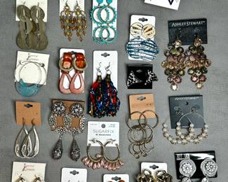 Collection of fashion earrings from brands such as Sugarfix by BaubleBar, Ashley Stewart, and Massini