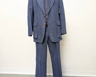 Incredible 1970s men's denim three-piece suit with leather-covered buttons; inside label from Brittany Ltd. Chicago. You could land a plane on those lapels...