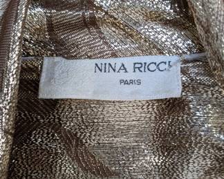 Closeup of Nina Ricci metallic gold floral pattern blouse