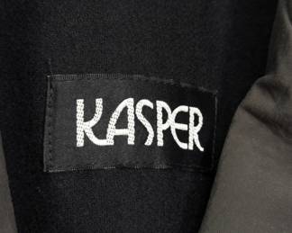 Closeup of the Kasper trench coat, a classic double-breasted outerwear piece