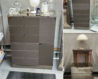 Ello gunmetal stainless and smoked mirror furniture including a tall boy dresser comprised of a mirrored top on two stacked three-drawer with one-door cabinet components, an Ello smoked mirror front 6-drawer dresser in two parts, and an Ello smoked glass mirrored three-drawer nightstand. 