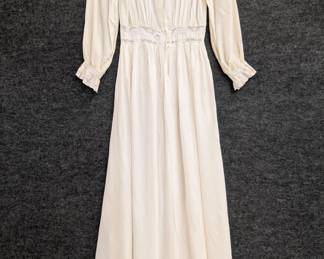 A 1940s Radcliff ivory color dressing robe with lace detailing at neck, waist and cuffs; rayon