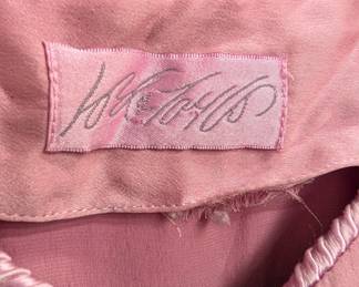 Closeup of a vintage Lord & Taylor dusty rose color women's long-sleeved button front blouse