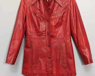 A 1970s red leather jacket by Ms Pioneer, featuring a sharp collar, fitted silhouette, and Western-style stitching on the chest; size  10