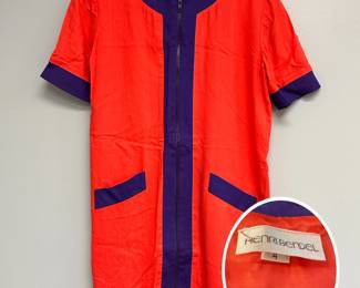A vintage Henri Bendel 1960s-style mod colorblock dress featuring a vibrant red-orange main body contrasted by navy blue trim and a central zipper; size 4
