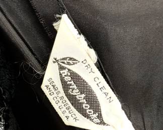 Tag inside the 40s-50s vintage Kerrybrooke for Sears little black dress with lace-edged V-neckline, and 3/4 length sleeves