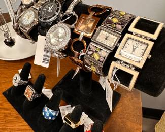 Ladies' fashion watches featuring various styles, and some fun costume jewelry rings