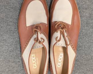 Another view of vintage Gucci spectator shoes in a brown and beige two-tone colorway, size 43-1/2