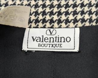 Closeup of Valentino black and white herringbone skirt suit set