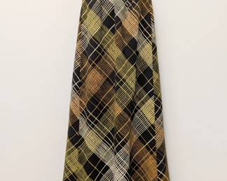 A vintage 1970s plaid maxi skirt in black, brown, yellow and cream