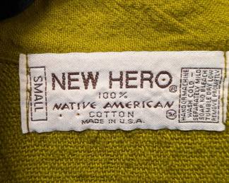 Closeup of New Hero vintage mustard yellow, long-sleeved, textured waffle knit shirt with a button-down placket and two front pockets, size Small