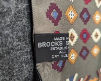 Closeup of a printed scarf featuring a design inspired by Navajo Yei figures