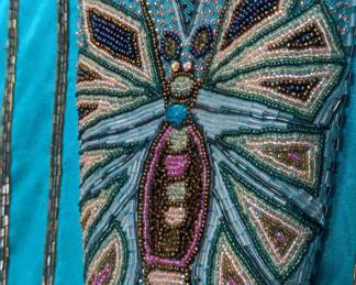 Closeup of Bonnie Boerer vintage 1980s butterfly sweater, turquoise with embroidery and sequins, size medium