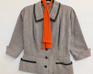 Vintage R & K Originals black and white plaid jacket with 3/4 length cuffed sleeves, orange necktie and black trim