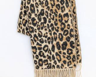 A woven leopard print scarf with fringe
