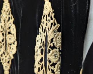 Closeup of the 1930s vintage black velvet dress with bolero style jacket