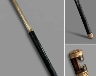 An antique telescoping handle designed for opera glasses or lorgnettes