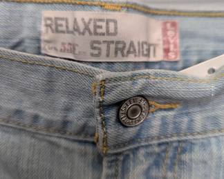 Closeup of Pair of Levi men's relaxed fit straight leg stonewash blue jeans 