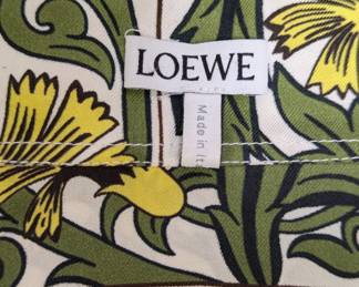 Closeup of Loewe x William De Morgan silk shirt with yellow carnation flower print in yellow and green, made in Italy