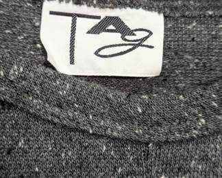 Closeup of TAG gray knit lounge wear long sleeved top and pants