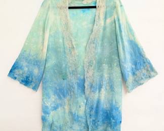 A vintage hand dyed robe or cardigan in a beautiful combination of blues and greens, edged with lace on the cuffs, front opening, and hem