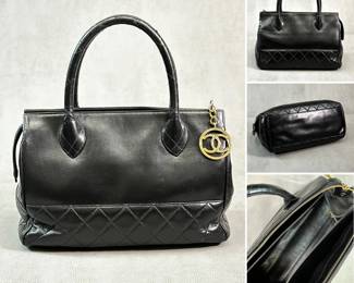 A vintage Chanel black lambskin "bowler" bag / Matelassé handbag, authenticated by Entrupy; features a mix of quilted and smooth surfaces and has gold tone CC charm attached to top zipper