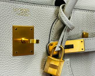 Closeup of the 2018 vintage Hermès size 30 Birkin in Togo “Craie” special order “HSS” horseshoe stamp with “Gris” interior – Perma Brass hardware, still has stickers on hardware. Authenticated by Entrupy.