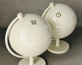 Two vintage Louis Vuitton boutique display globes