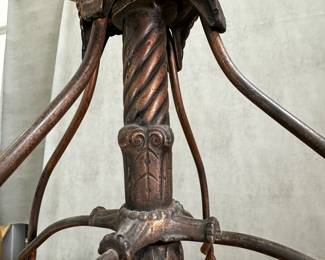 Closeup of the antique Max Tonk "twisted wire" drafting architect office revolving chair, by the Tonk Mfg Co of Chicago, iron and wood, with adjustable seat