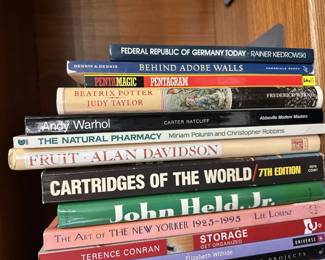 Books including The Art of the New Yorker 1925-1995, The Natural Pharmacy, Andy Warhol by Carter Ratcliff, Behind Adobe Walls, Federal Republic of Germany Today, Beatrix Potter by Judy Taylor
