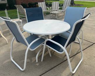 White metal bistro set with blue mesh sling chairs