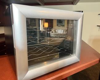 Countertop wine refrigerator with silver frame and wire racking