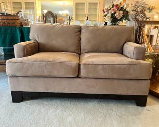 Premium Bauhaus tan micro-suede loveseat with a dark wood base and plush cushions