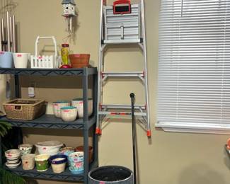 Little Giant ladder and various flower pots
