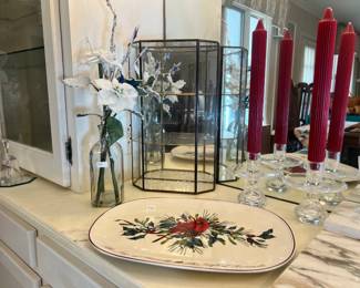 Cardinal-themed holiday serving platter, brass and glass display curio, and crystal candlestick holders