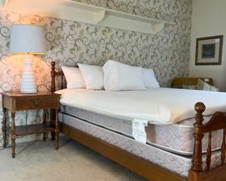 Solid wood queen bed (frame, mattress, box spring all included). There is a King Tempur-Pedic mattress topper pictured as well