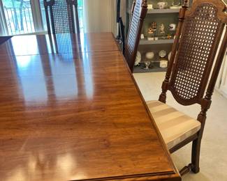 Thomasville wood dining table and set of 8 high-back cane chairs (comes with additional leaf)