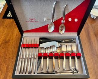 Vintage 1847 Rogers Bros. silver-plated flatware set in a display chest