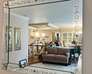 Large Venetian-style wall mirror with decorative floral etching