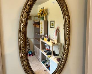 Oval gold mirror
