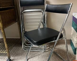 Set of authentic Nevco chrome-frame folding chairs with black vinyl padded seats