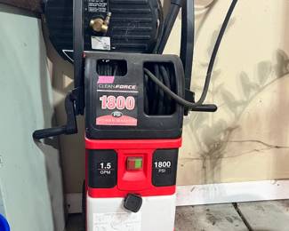 CleanForce 1800 PSI electric power washer with hose reel and surface cleaner attachment