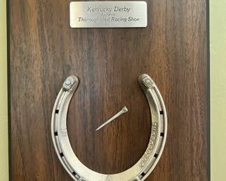 Authentic Thoroughbred racing shoe from the Kentucky Derby mounted on a commemorative wooden plaque
