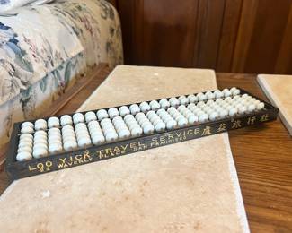 Vintage "Loo Yick Travel Service" advertising abacus from Waverly Place, San Francisco
