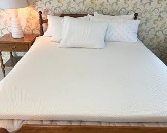 Solid wood queen bed (frame, mattress, box spring all included). There is a King Tempur-Pedic mattress topper pictured as well